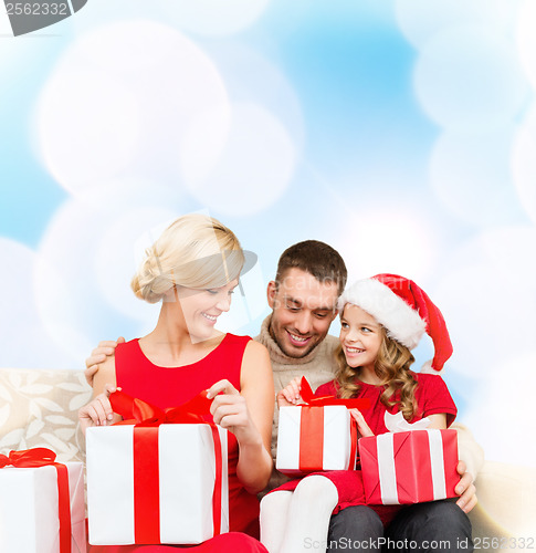 Image of happy family opening gift boxes