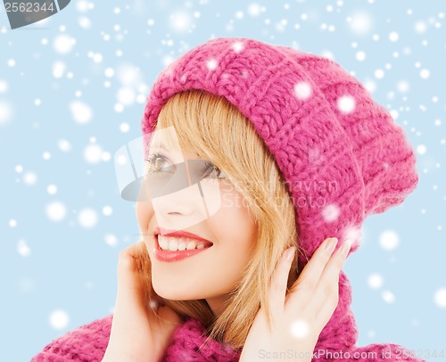 Image of woman in pink hat and scarf