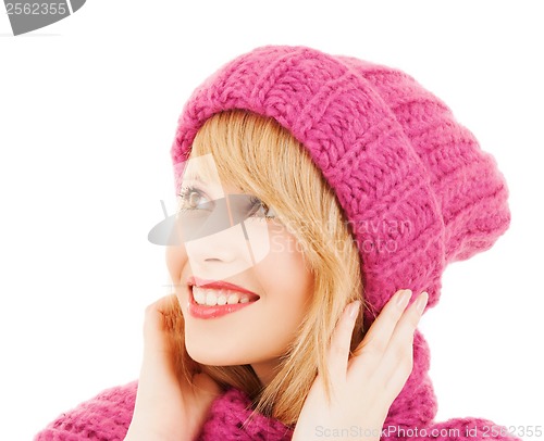 Image of woman in pink hat and scarf