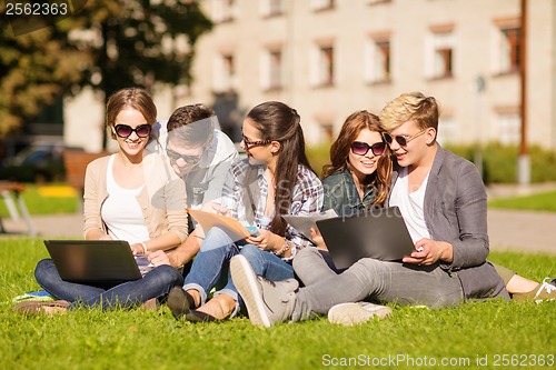 Image of students or teenagers with laptop computers