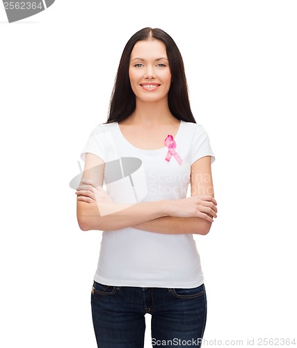 Image of smiling woman with pink cancer awareness ribbon