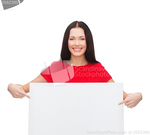 Image of smiling young woman with blank white board