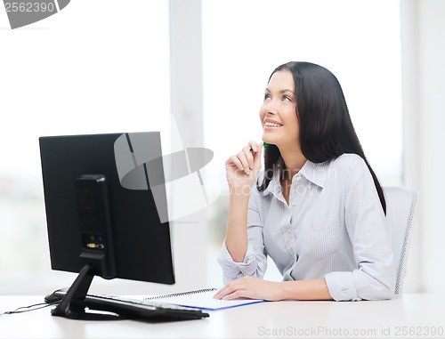 Image of smiling businesswoman or student studying