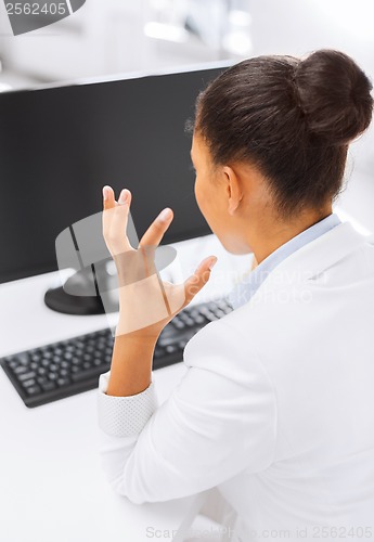 Image of stressed businesswoman with computer