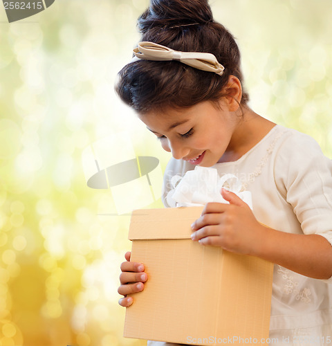 Image of happy child girl with gift box