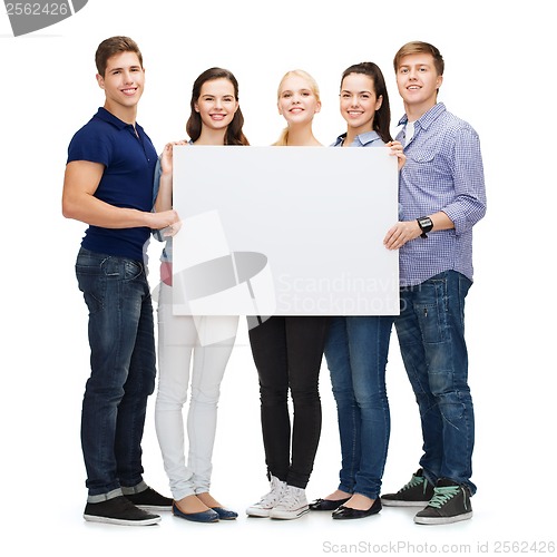 Image of group of smiling students with white blank board