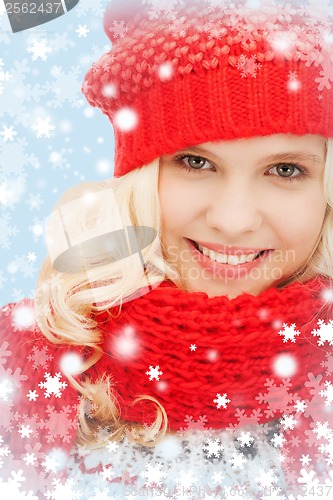 Image of teenage girl in red hat and scarf