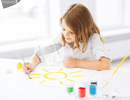 Image of little girl painting picture