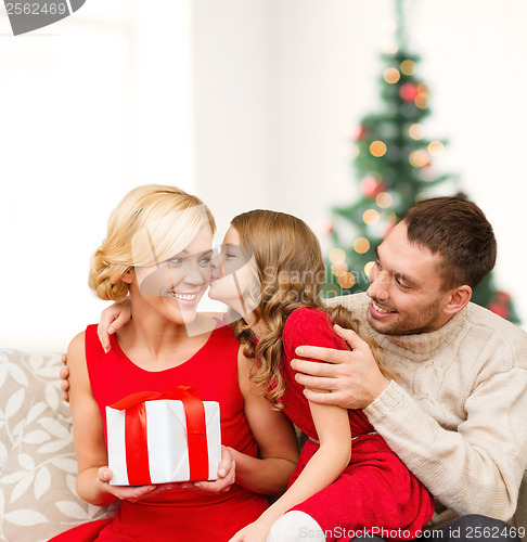 Image of adorable child kisses her mother