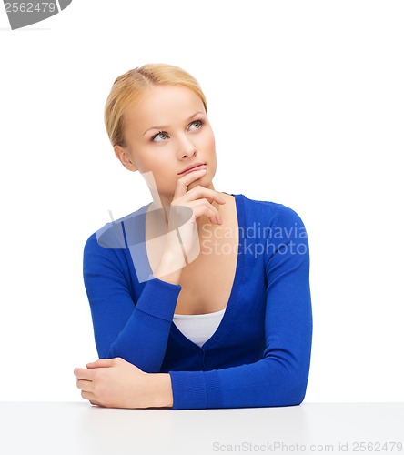 Image of serious young woman making decisions