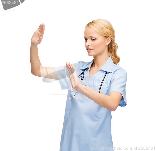 Image of doctor or nurse working with virtual screen