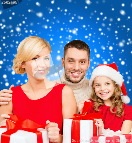 Image of smiling family holding many gift boxes