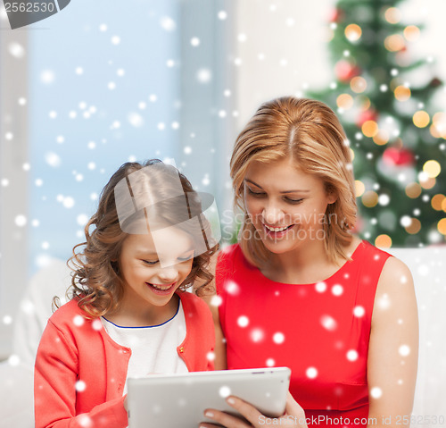 Image of mother and daughter with tablet pc
