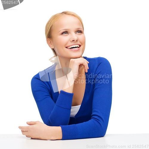 Image of happy smiling young woman dreaming and laughing