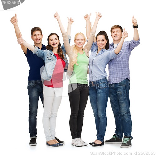 Image of group of smiling students showing thumbs up