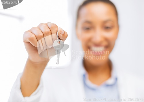 Image of woman hand holding house keys