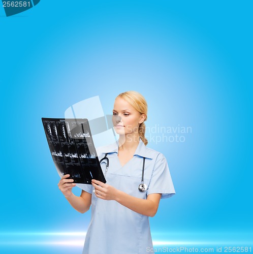 Image of female doctor or nurse in mask holding syringe