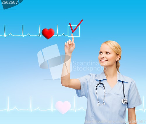 Image of smiling doctor or nurse pointing to something