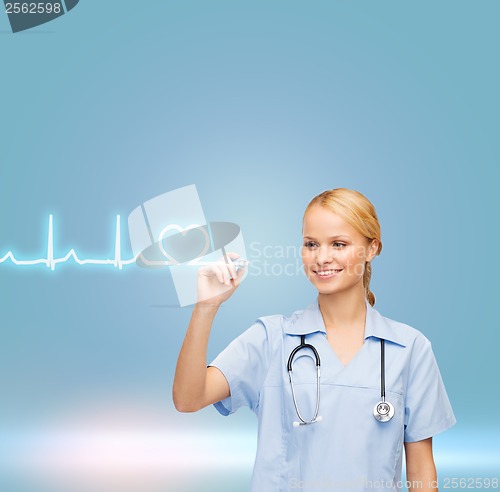 Image of smiling doctor or nurse drawing cardiogram