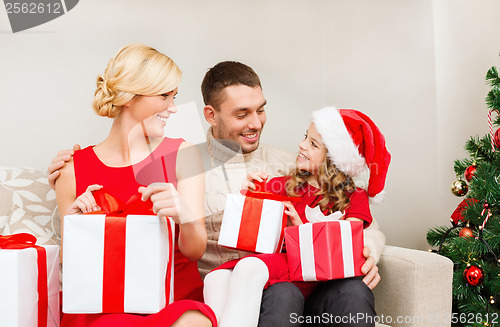 Image of happy family opening gift boxes