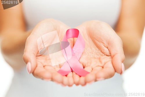 Image of hands holding pink breast cancer awareness ribbon