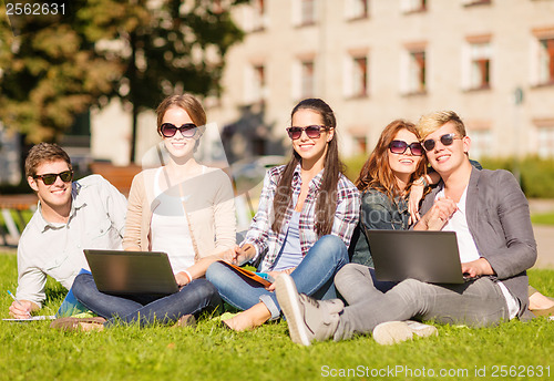 Image of students or teenagers with laptop computers