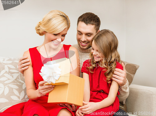 Image of happy family opening gift box