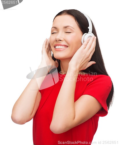 Image of smiling woman with headphones