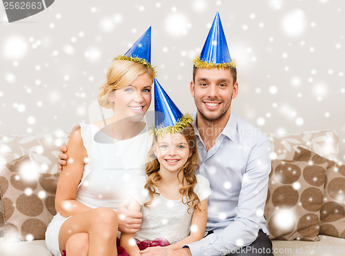 Image of happy family in hats celebrating