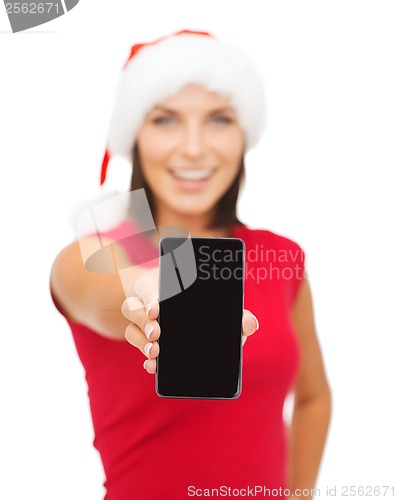 Image of smiling woman in santa helper hat with smartphone