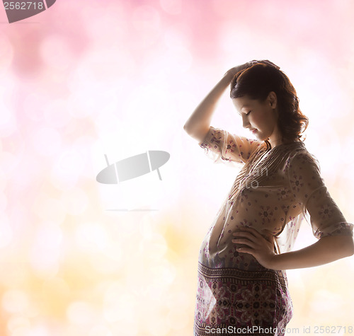 Image of silhouette picture of pregnant beautiful woman