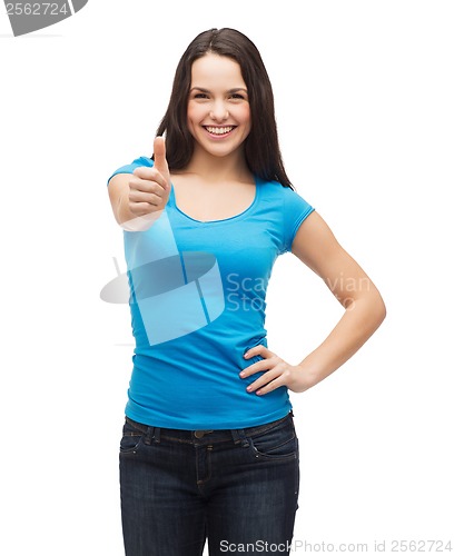 Image of smiling girl in blue t-shirt showing thumbs up