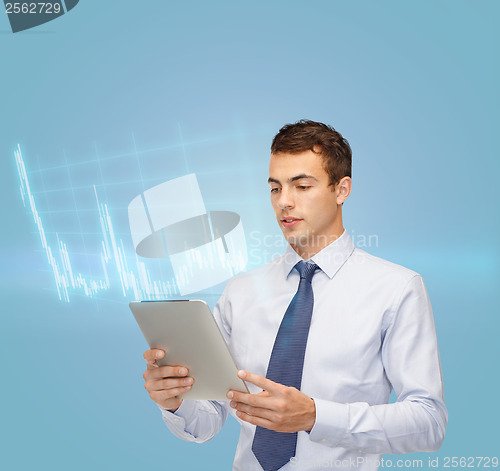 Image of buisnessman with tablet pc and forex chart