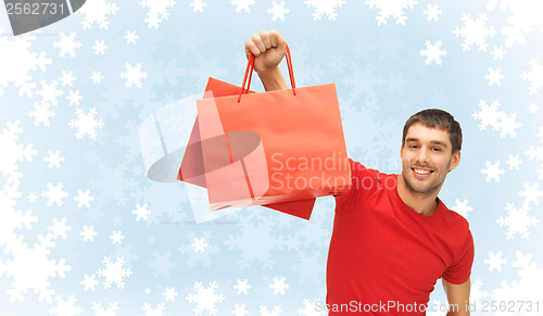 Image of smiling man with shopping bags
