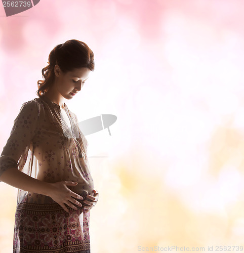 Image of silhouette picture of pregnant beautiful woman