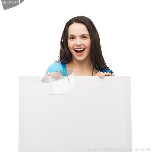 Image of smiling young girl with blank white board