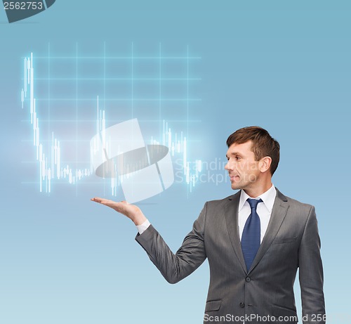 Image of buisnessman or teacher showing forex chart