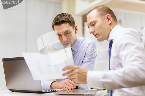 Image of two businessmen having discussion in office