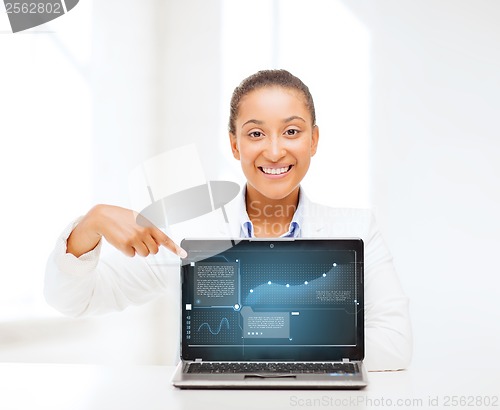 Image of smiling woman with laptop computer