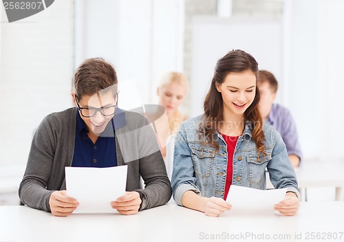 Image of two teenagers looking at test or exam results