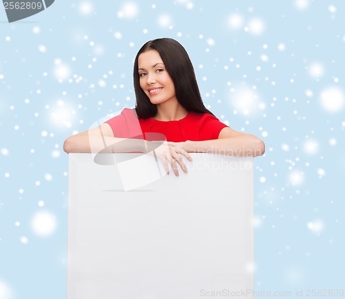 Image of smiling young woman with blank white board