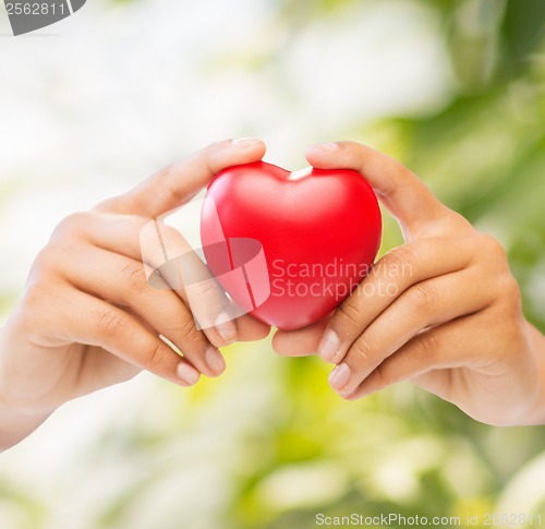 Image of woman hands with heart