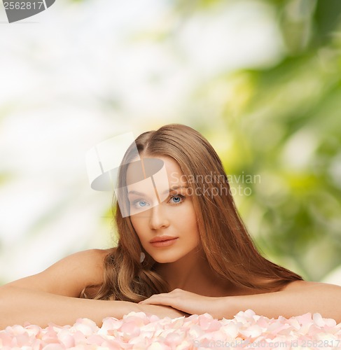 Image of woman with rose petals and long hair