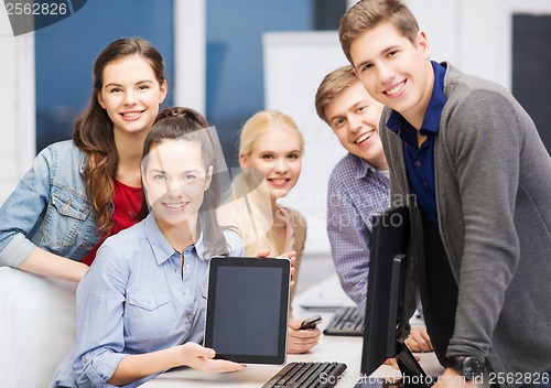 Image of students with monitor and blank tablet pc screen