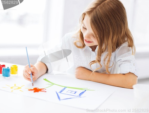 Image of little girl painting picture