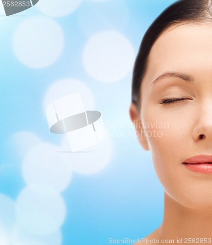 Image of relaxed young woman with closed eyes