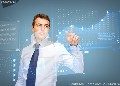 Image of businessman working with virtual screen