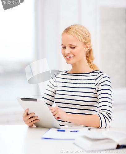 Image of student with tablet pc computer and notebook