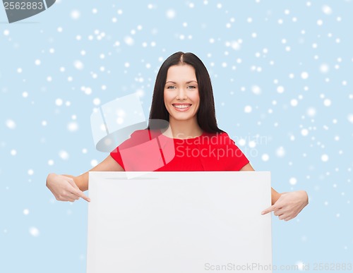 Image of smiling young woman with blank white board