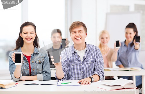 Image of students showing black blank smartphone screens